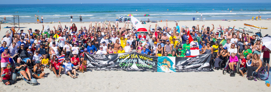 All ISA Adaptive Surfing Clinic participants gather for a photo in La Jolla Shores. Photo: ISA/Val Reynolds