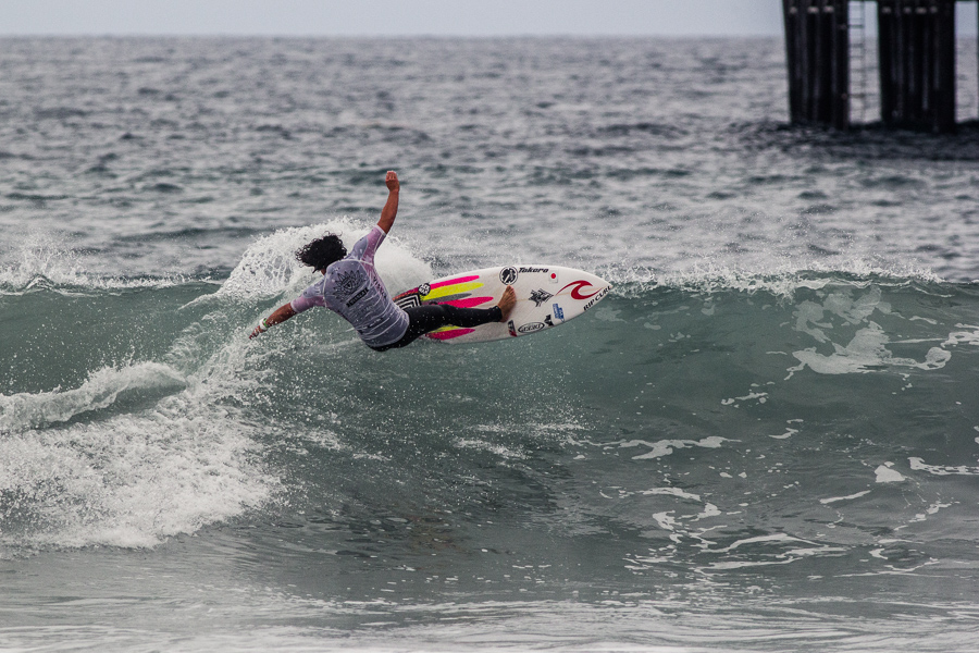 Japan’s Reo Inaba fully commits to a turn on the south side of Oceanside Pier. Photo: ISA/Chris Grant