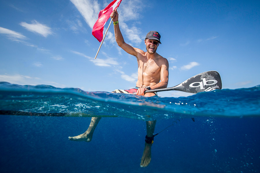 Casper Steinfath soaks in the joy of winning his third Gold Medal in the Men’s SUP Technical Race. Photo: ISA / Ben Reed