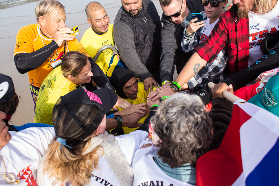 Team Hawaii huddles to show support for Buster Kawasaki. Photo: ISA / Chris Grant