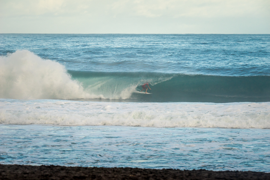 Peru’s Alonso Correa finds a running barrel in route to scoring the highest heat total of the day (14.67) for the second time in the competition. Photo: ISA / Sean Evans