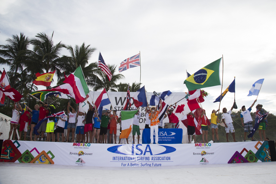 ISA President Fernando Aguerre amongst the flags of the 27 National Teams, officially declared open the 2015 ISA World SUP and Paddleboard Championship Presented by Hotel Kupuri in Sayulita, Mexico. Photo: ISA/Brian Bielmann