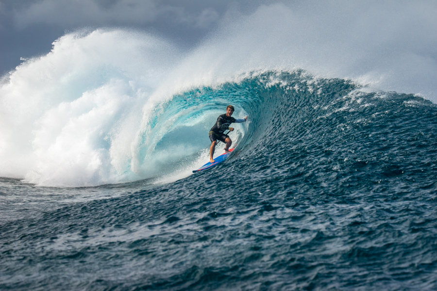 Hawaii’s Zane Schweitzer pulls into a barrel at Cloudbreak with his signature Aloha smile. Photo: ISA / Sean Evans